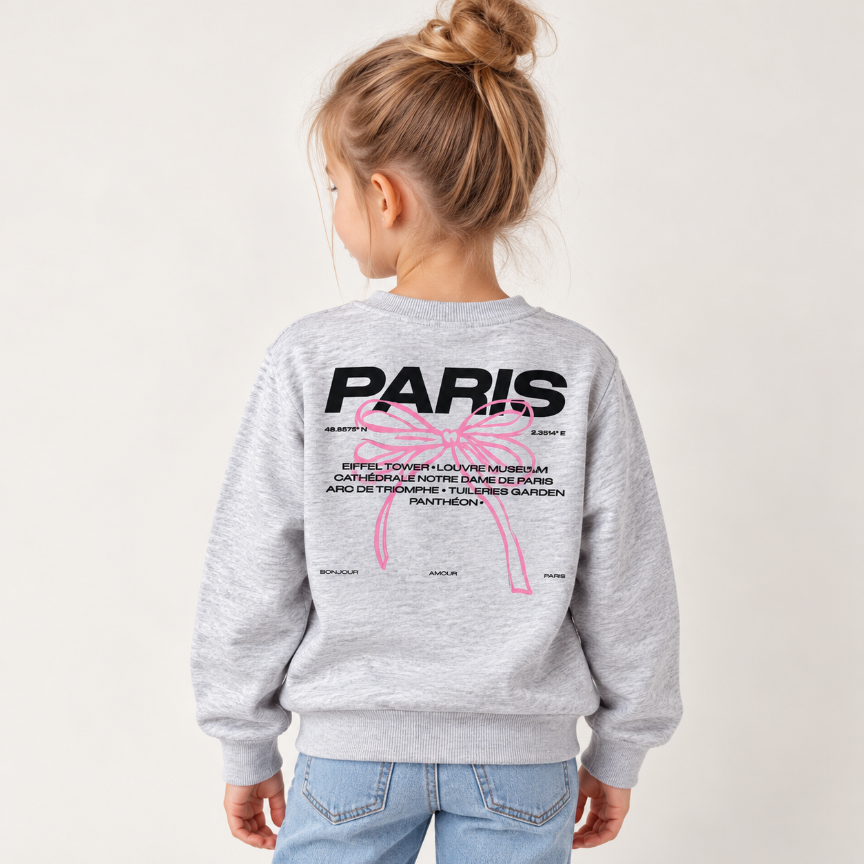 Bluza dziewczęca Name It PARIS z dużym nadrukiem i różową kokardą na plecach